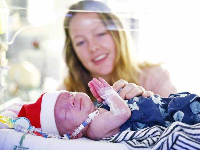 WEEKEND TELEGRAPHS - 14.12.23MUST NOT PUBLISH  BEFORE CLEARING WITH PIC EDITOR  - Premature new borns ready to celebrate Xmas at Royal Women Hospital in Randwick today. Max Kovac born 1st September pictured with mum Lucy Capel at rear. Picture: Sam Ruttyn