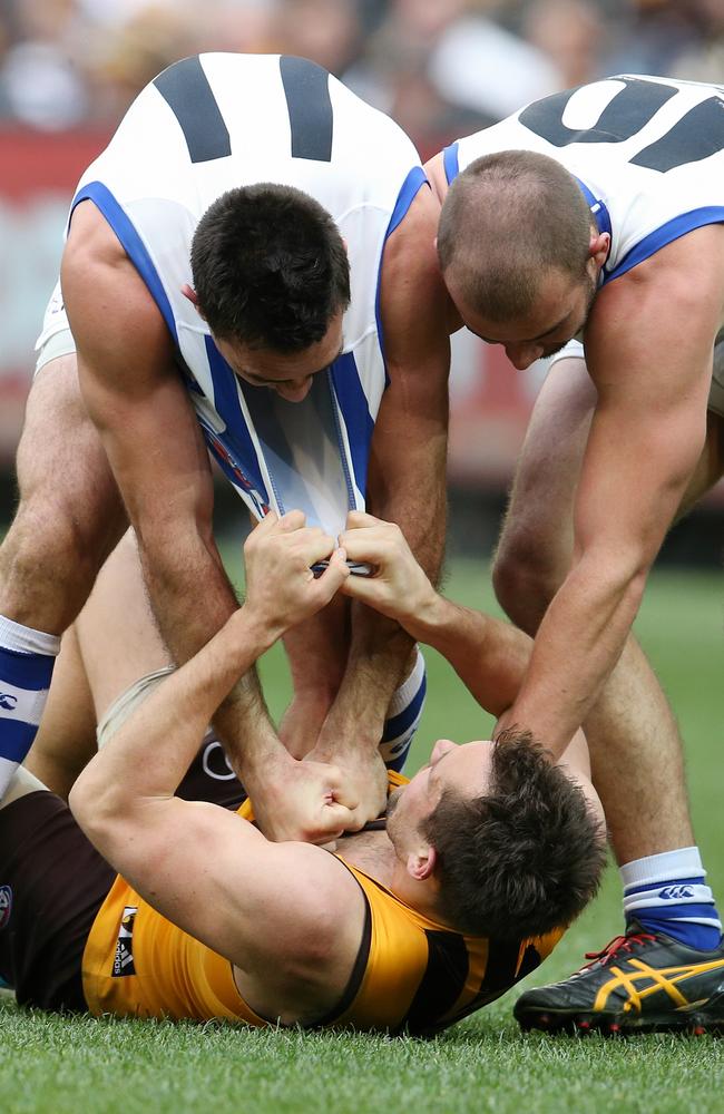 Michael Firrito and Ben Cunnngton got stuck into Luke Hodge. Picture: Michael Klein