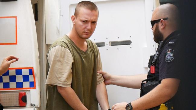 Jake Scott Ashman, 22, walks into his first appearance at Maryborough Magistrates Court after being charged with murder.