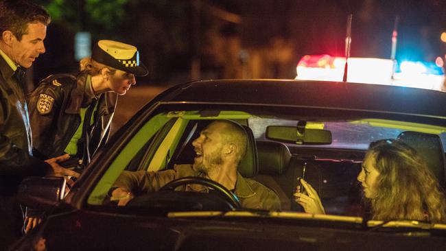 Actors Jeff Lang and Emma Beech in a scene with an angry motorist for Dark Blue. Picture: Supplied