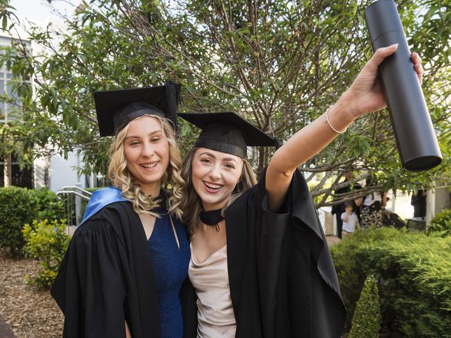 Sienna Deegan (left) and Kassidy Bauer met at placement and graduate together with a Bachelor of Nursing at a UniSQ graduation ceremony at Empire Theatres, Tuesday, October 31, 2023. Picture: Kevin Farmer