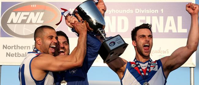 Ahmed Saad, Rob Maiorana and Nathan Valladares get their hands on the premiership trophy.