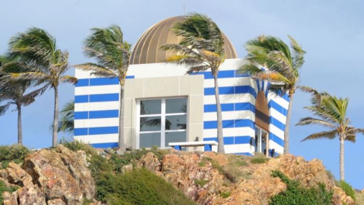 Structures on the island include a mansion and a bizarre blue and white temple. Picture: Splash News