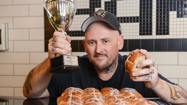 Banana Boogie bakery owner and head baker Jason Spencer with his hot cross buns. Picture: Brenton Edwards