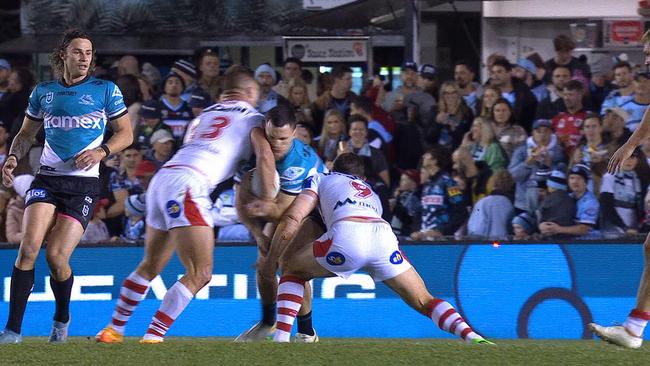 Tariq Sims tackles Sharks star Connor Tracey.