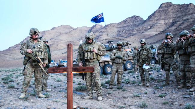 Dawn service ... Australian soldiers of Mentoring Task Force 4 hold an Anzac Day Dawn Service in the desert near Chenatu in Eastern Urozgan Province of Afghanistan. Picture: News Ltd