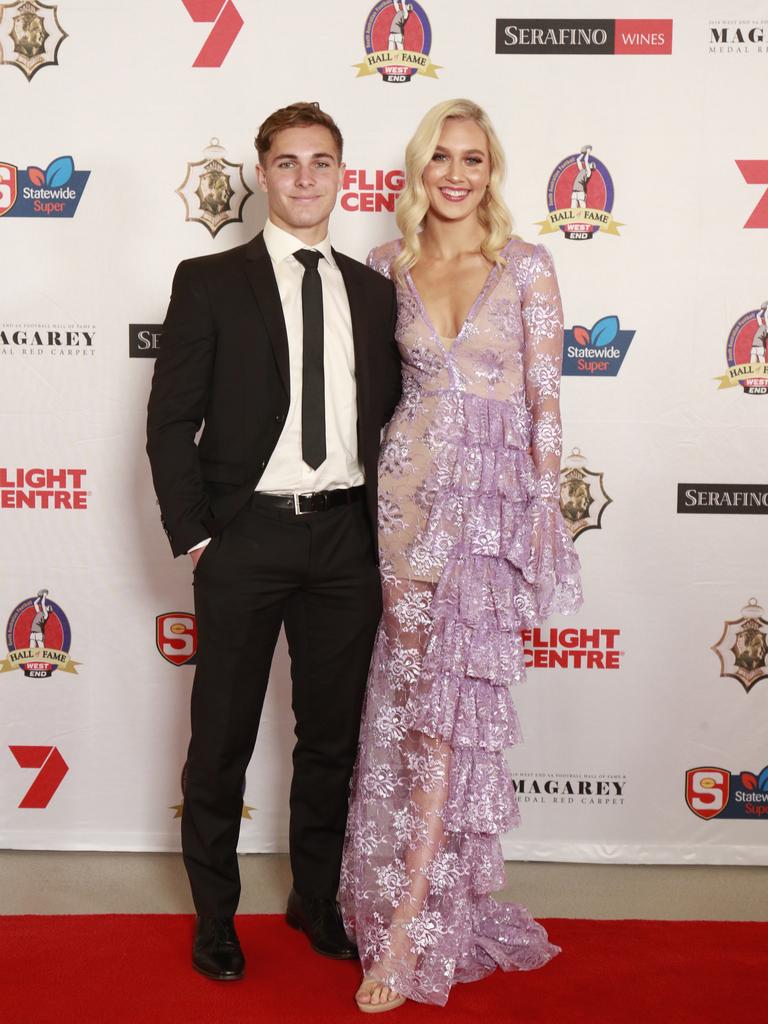 Boyd Woodcock and Hanni Howe pose for a picture on the red carpet at Adelaide Oval in North Adelaide, for the Magarey Medal, Monday, September 9, 2019. Picture: Matt Loxton