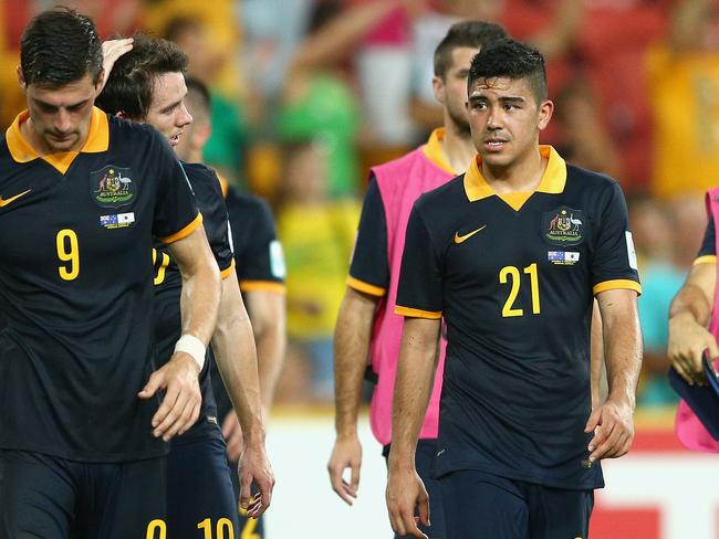 BRISBANE, AUSTRALIA - JANUARY 17: Massimo Luongo (C) of the Socceroos and team mates look dejected after losing the 2015 Asian Cup match between Australia and Korea Republic at Suncorp Stadium on January 17, 2015 in Brisbane, Australia. (Photo by Cameron Spencer/Getty Images)