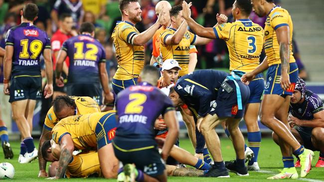 Ray Stone (left, on ground) injured his knee while scoirng the match-winnre for the eels in golden point against Melbourne. Picture: Kelly Defina/Getty Images