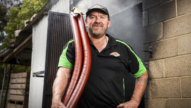 Mt Pleasant butcher shop owner Jamie Hylan with another batch of mettwurst at their Barossa Valley smokehouse. Picture: AAP/MIKE BURTON