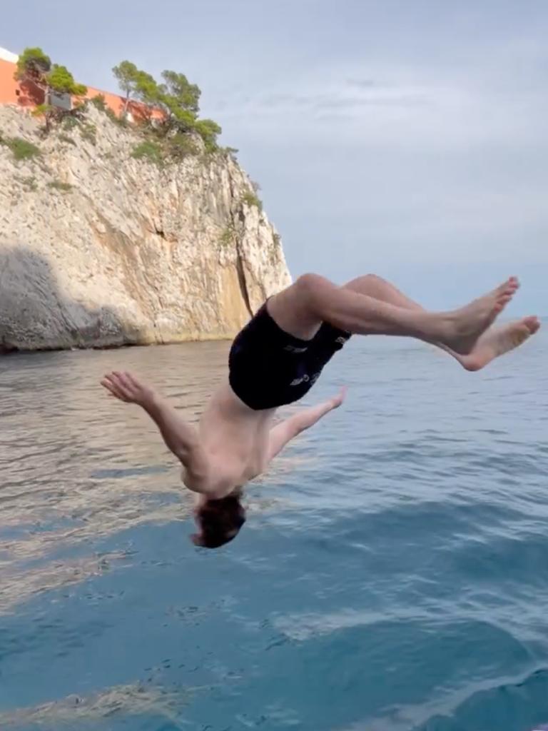 Liam Hampson jumping off their boat with a backflip into the water. Picture; Jordan Riki / Instagram