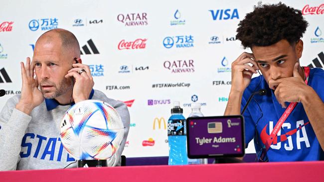 USA's coach Gregg Berhalter (L) and midfielder Tyler Adams faced a heated press conference.