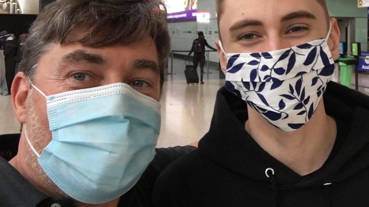 Carl (L) with his son Oliver (R) at Heathrow airport before the 16-year-old got on the flight.