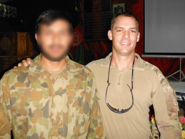 Captain Jason Scanes and his interrupter in Afghanistan, whose life is in danger over his assistance to coalition forces.