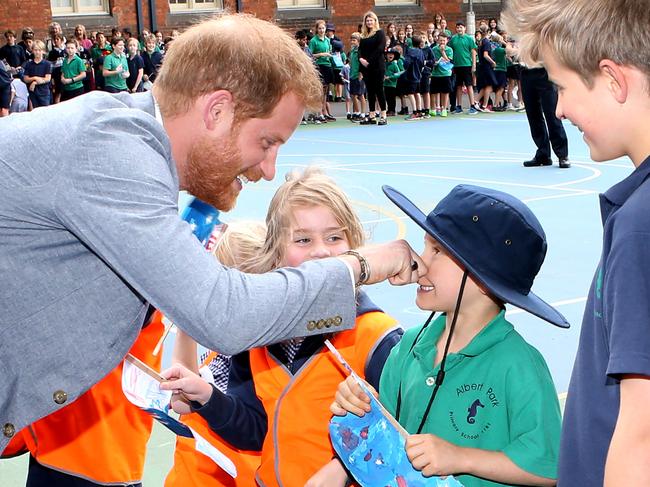 Harry has fun with the kids at Albert Park Primary School. Picture: David Caird