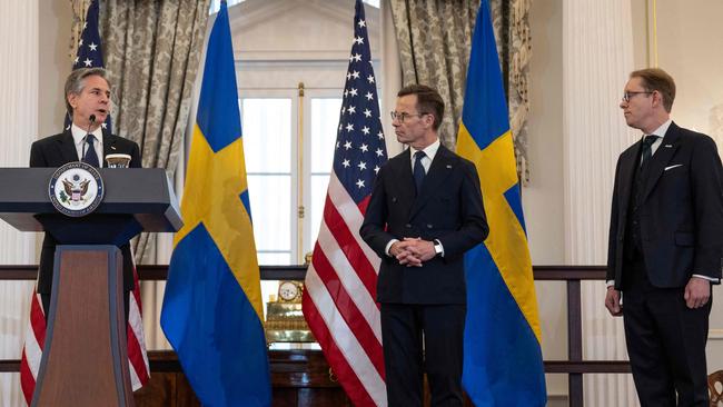 US Secretary of State Antony Blinken, with Swedish Prime Minister Ulf Kristersson (C) and Foreign Minister Tobias Billstrom, speaks during the NATO ratification ceremony at the US State Department. Picture: AFP.