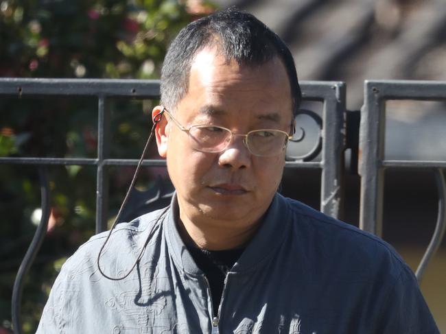 Mr Chen outside his other home next door to the burnt down mansion. Picture: John Grainger