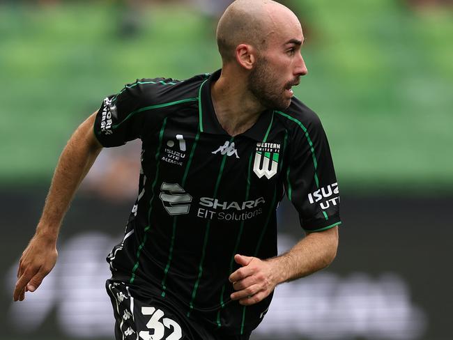 MELBOURNE, AUSTRALIA - DECEMBER 01: Angus Thurgate of Western United runs with the ball during the round six A-League Men match between Western United and Melbourne Victory at AAMI Park, on December 01, 2024, in Melbourne, Australia. (Photo by Robert Cianflone/Getty Images)