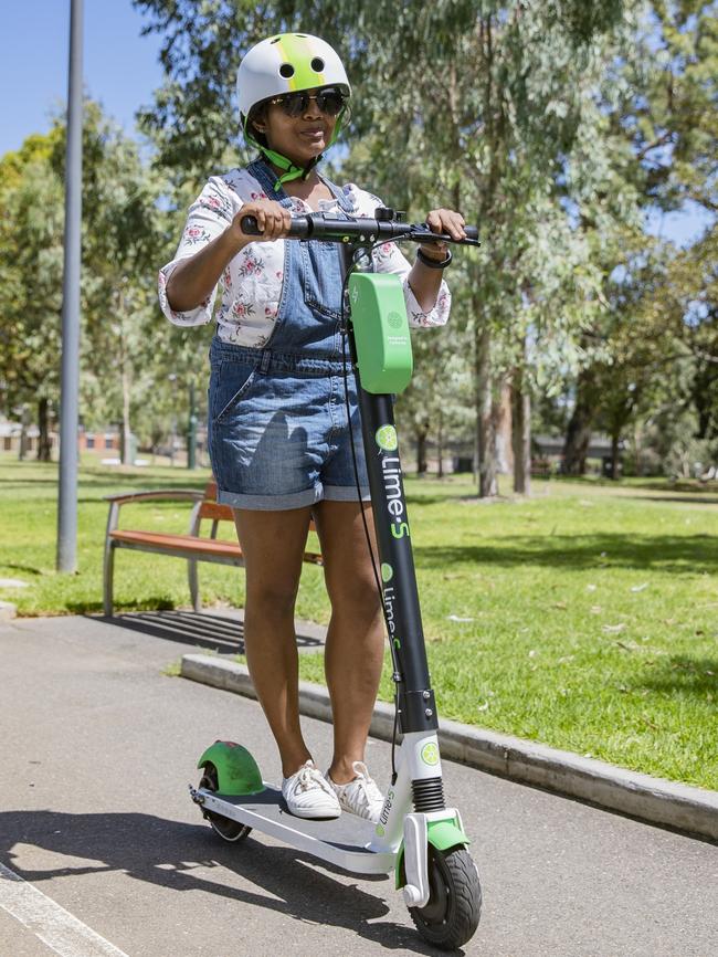 Sachini Fernando from Sri Lanka enjoying herself on one the new Lime e-scooters on trial in Adelaide during the Fringe Festival. Picture Simon Cross