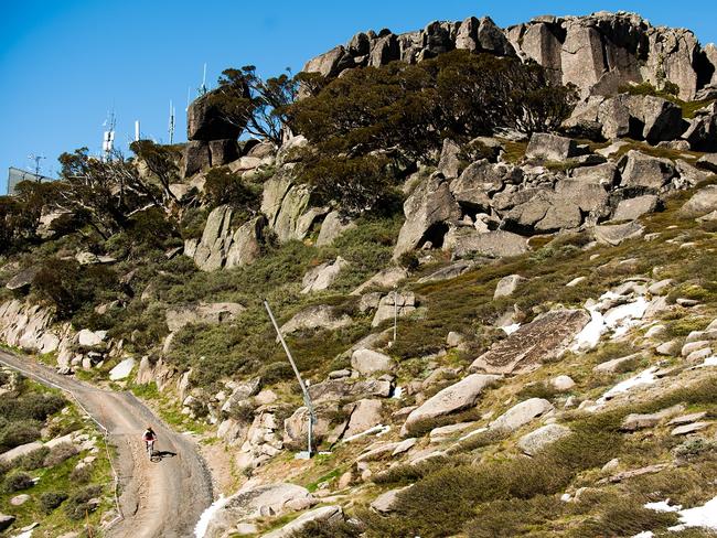 Bike riders zigzag down the mountain.