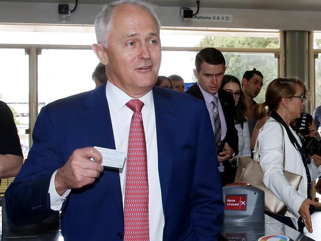 Prime Minister Malcolm Turnbull walks through the ticket barriers. Pic: Sue Graham/AAP Image