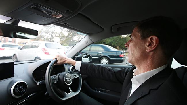 Ben English in his car stuck in traffic. Photo: Adam Yip