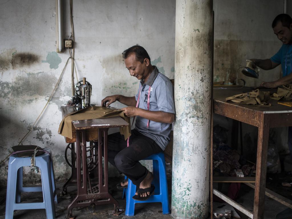 A tailor working in Banda Aceh, Indonesia. Picture by Matt Turner.