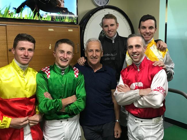 James McDonald (yellow), Tom Marquand (green), Chris Barrett (centre, black shirt), Tommy Berry (behind in black), Brenton Avdulla (red silks, white sleeve), and Tim Clark.