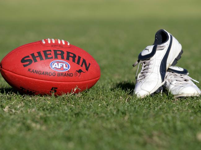 Generic AFL Sherrin football and football boots. sport /