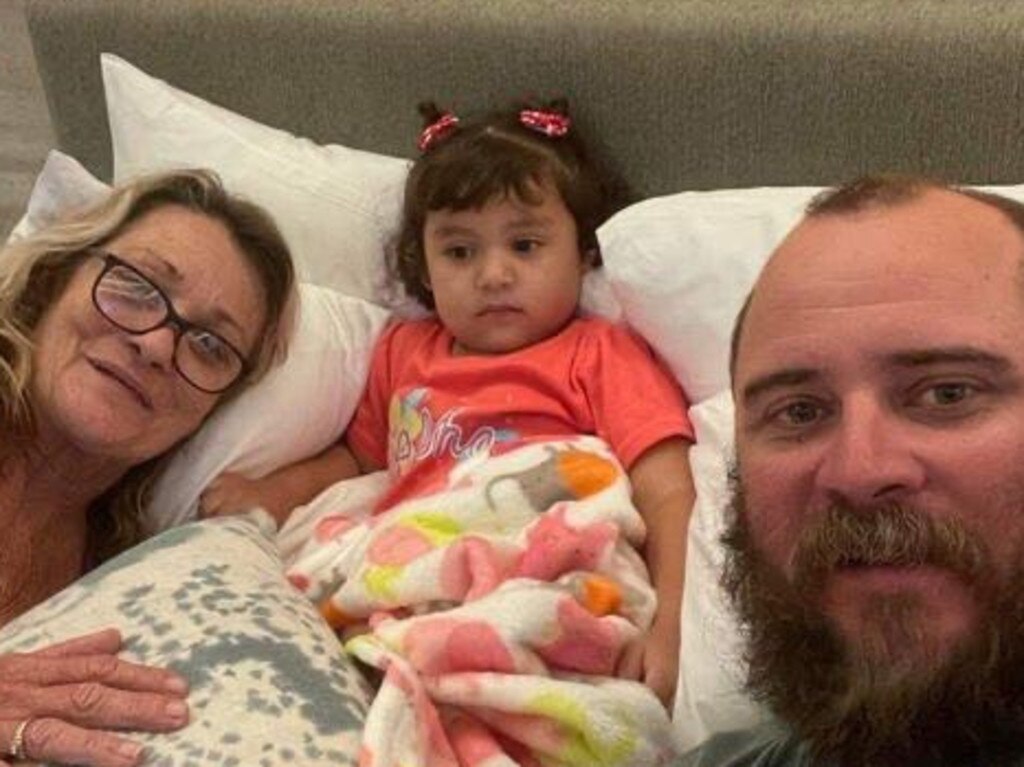 Adelynn, 2, has been reunited with her Mackay uncle Ben Shanks and Brisbane grandmother Leanne in Cancun in Mexico after she was dumped at church. Her parents remain missing. Picture: Supplied