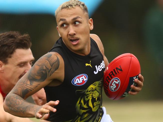 MELBOURNE, AUSTRALIA - FEBRUARY 26: Shai Bolton of Tigers under pressure from Jake Lever of Demons during the AFL Practice Match between the Melbourne Demons and the Richmond Tigers at Casey Fields on February 26, 2021 in Melbourne, Australia. (Photo by Mike Owen/Getty Images)