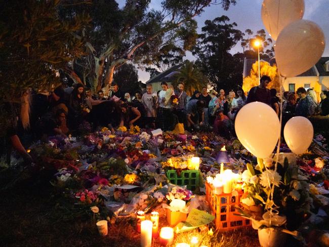 The site where the body of Aiia Maasarwe was found is surrounded by mourners and flowers in Bundoora. Picture: AAP/Stefan Postles