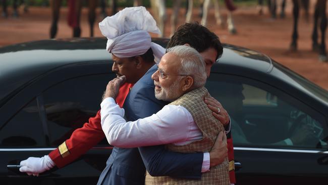 Narendra Modi embraces Justin Trudeau at the presidential palace in New Delhi today. Picture: AFP