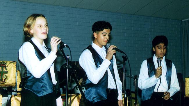 Guy Sebastian (c) singing at his high school before Idol fame. Picture: Supplied.