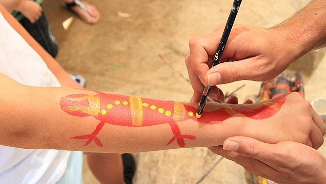 Will has his arm painted at the new Dreamworld Corroboree area.