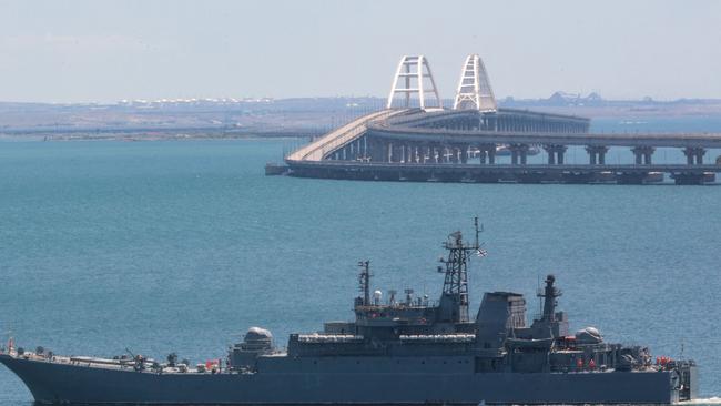 A Russian warship sailing near the Kerch bridge linking the Russian mainland to Crimea, following an attack in 2022. Picture: AFP