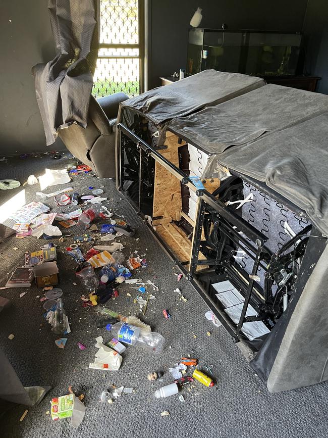 A couch had been torn apart and rubbish littered the floors.