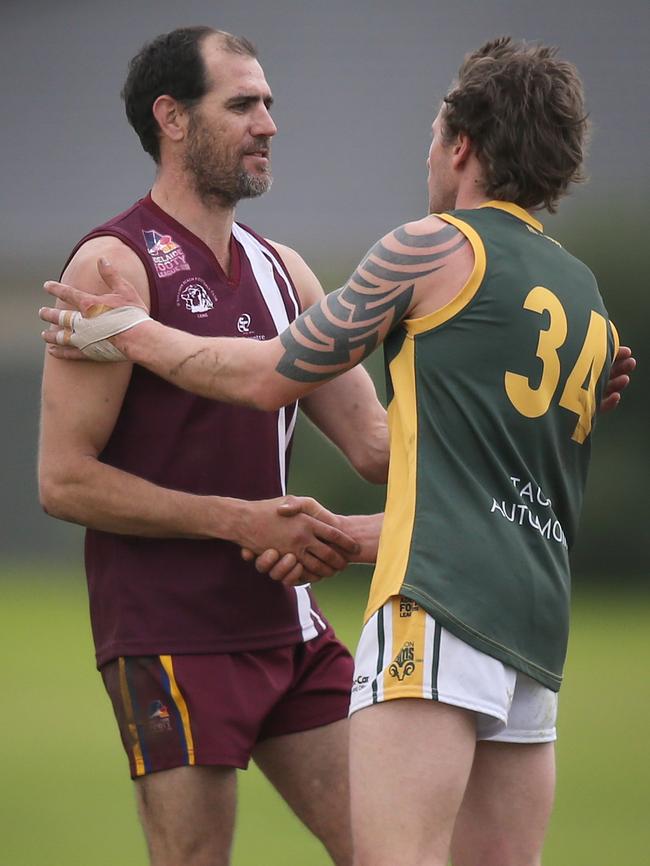 OSB Lonsdale's Trevor Rigney, left, kicked four goals but the Lions were no match for the Hawks. Picture: AAP/Dean Martin