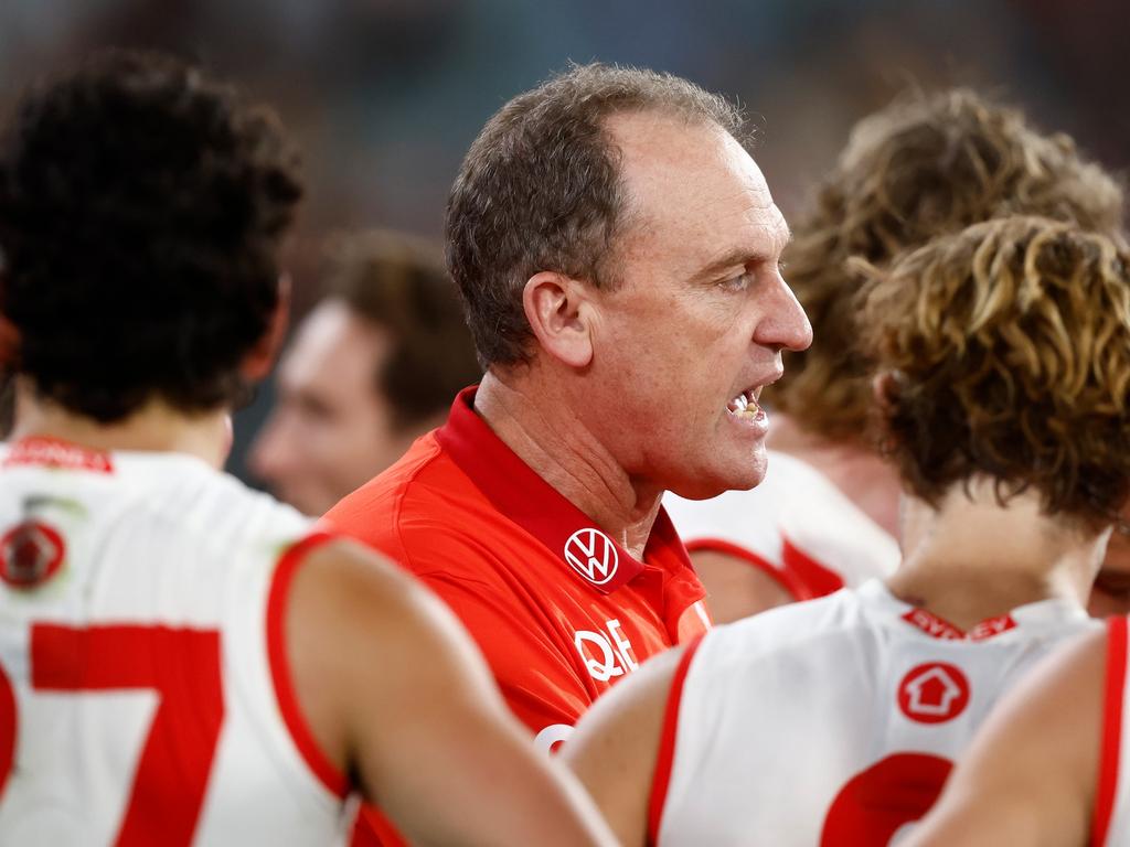 MELBOURNE, AUSTRALIA – APRIL 28: John Longmire, Senior Coach of the Swans addresses his players during the 2024 AFL Round 07 match between the Hawthorn Hawks and the Sydney Swans at the Melbourne Cricket Ground on April 28, 2024 in Melbourne, Australia. (Photo by Michael Willson/AFL Photos via Getty Images)