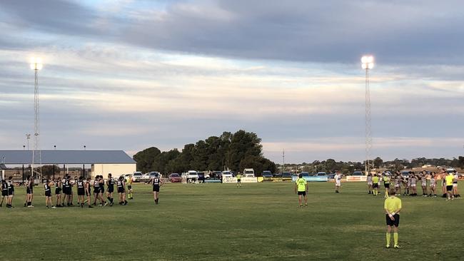 Umpires conduct the headcount during the Waikerie and Loxton North clash — which resulted in Waikerie losing a 44-point lead and ultimately a 31-match winning streak for having too many players on the field.