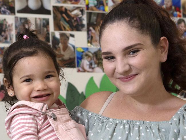 Peer support worker Molli Robinson and her daughter Armani Savea 1 pose for a photograph at the Young Mothers for Young Women centre in Caboolture, Friday March 20, 2020. The centre offers the opportunity for young mothers to learn essential parenting skills. (AAP/Image Sarah Marshall)