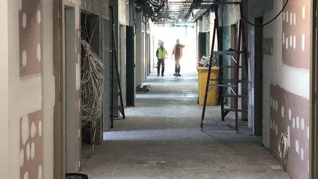 Construction workers in the building accommodating the general and surgical wards at the hospital. Picture; Jim O'Rourke