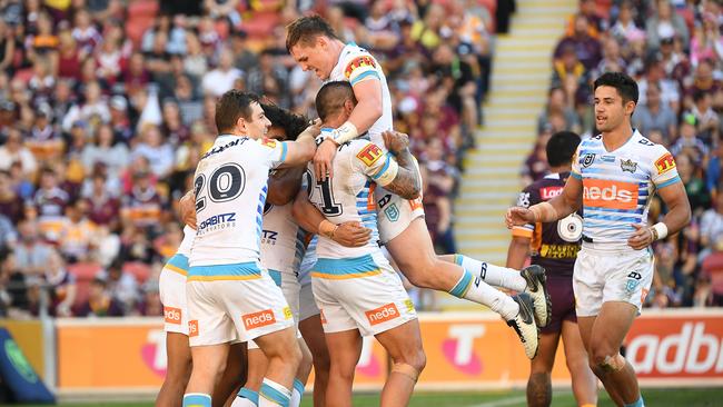 Titans players react after Tyrone Roberts scored a try during the Round 13 NRL match between the Brisbane Broncos and the Gold Coast Titans at Suncorp Stadium in Brisbane, Sunday, June 9, 2019. (AAP Image/Dave Hunt) NO ARCHIVING, EDITORIAL USE ONLY