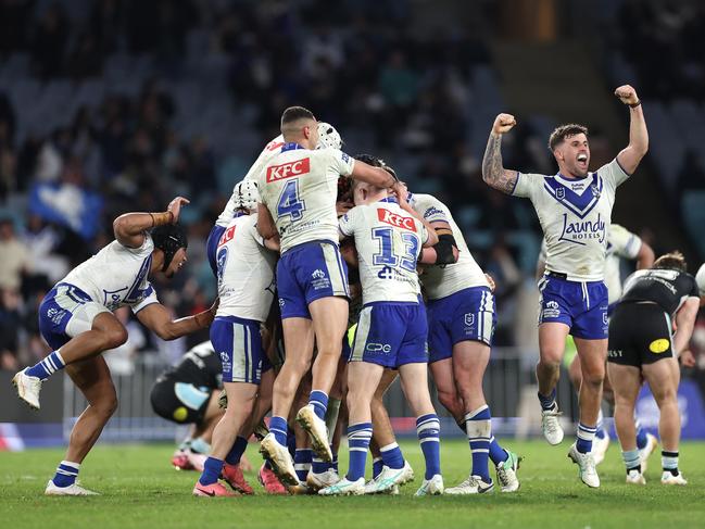 Matt Burton of the Bulldogs celebrates with teammates after kicking a golden point field goal in extra time to win the round 17 NRL match between Canterbury Bulldogs and Cronulla Sharks. Picture: Getty Images