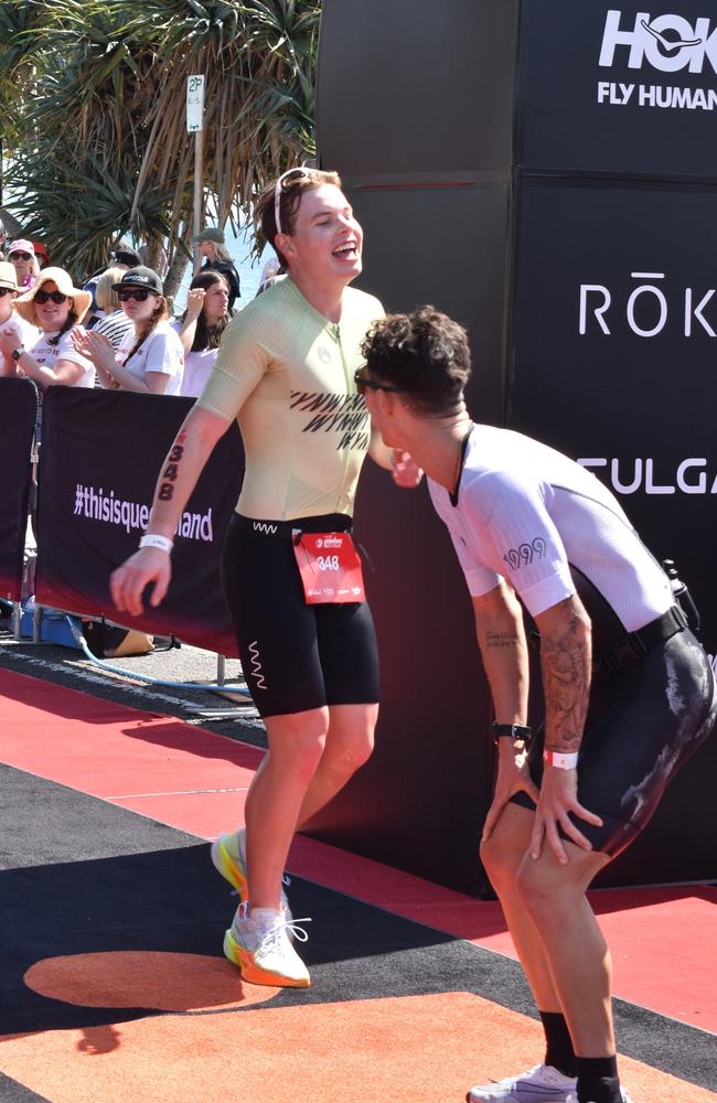 Athletes crossing the finish line at the Sunshine Coast Ironman 70.3 2023.