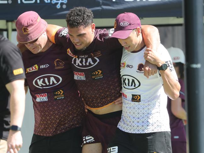 Xavier Coates is carried from the field. Brisbane Broncos training at Red Hill. Pic Peter Wallis