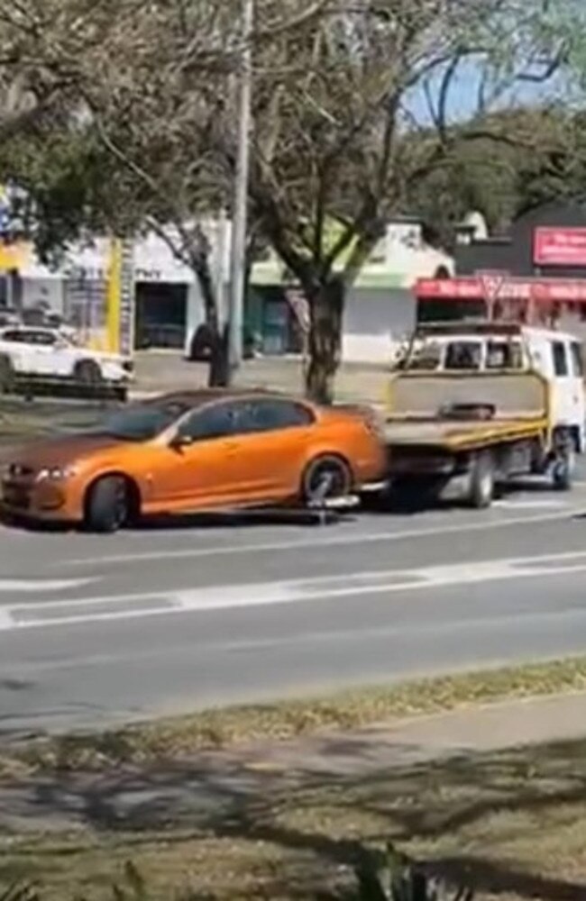 The Holden Commodore being taken away by a tow truck. Photo: Dennis Taunoa