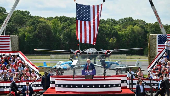 Donald Trump speaks behind bulletproof glass during the campaign rally at the North Carolina Aviation Museum &amp; Hall of Fame in Asheboro, North Carolina.