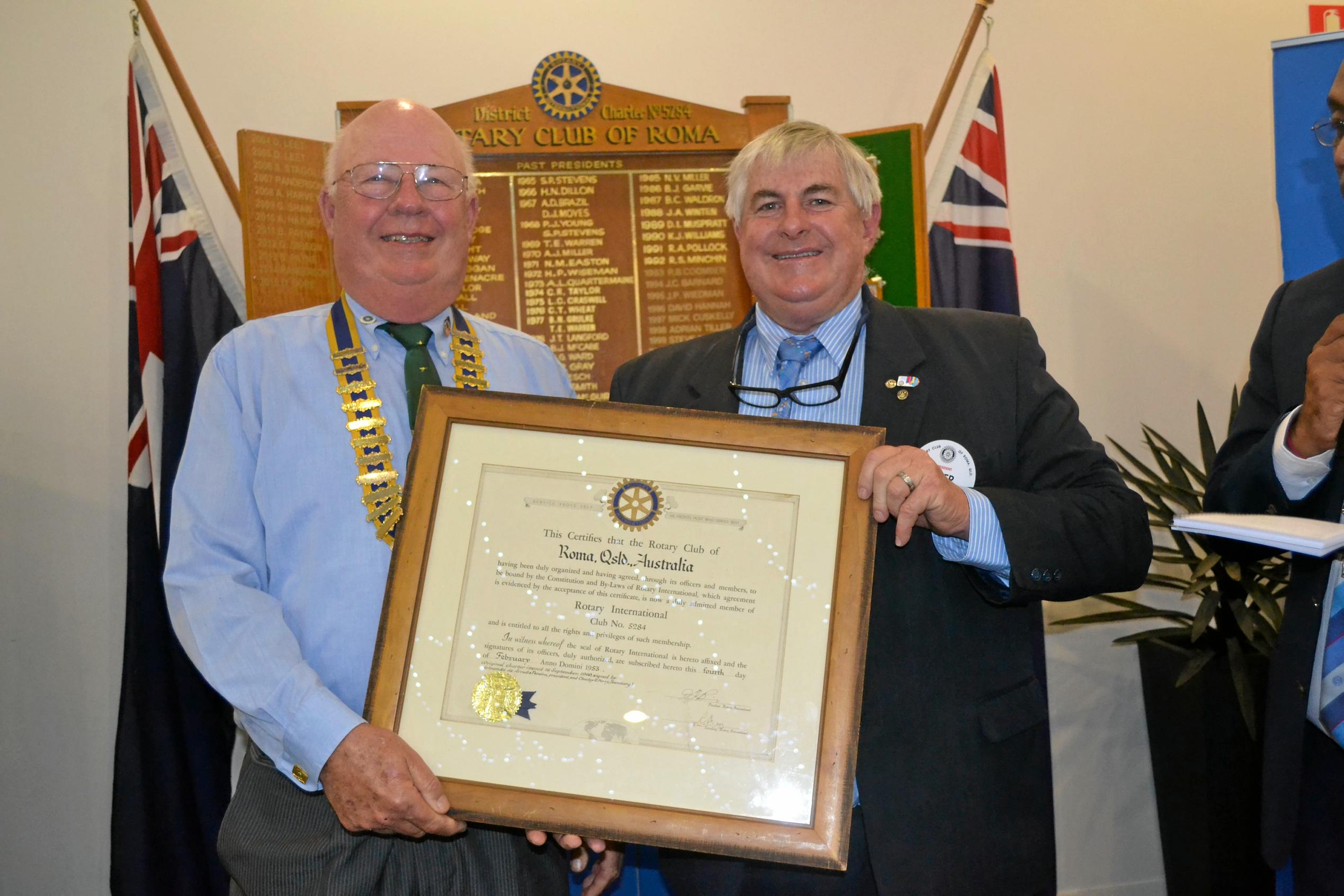 Peter Moloney officially hands over the role of president to Greg Shaw. Picture: Molly Hancock