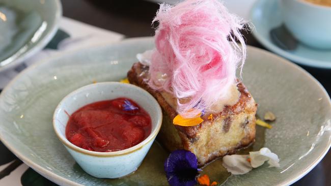 Lady Marmalade Cafe came in no.3. Their raisin pain au lait french toast with rhubarb compote, sea salt and nut brown butter ice cream and pure maple syrup topped with fairy floss is a decadent way to start the day. Picture: AAP/Ric Frearson